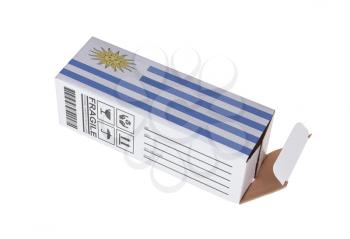 Concept of export, opened paper box - Product of Uruguay