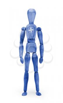 Wood figure mannequin with flag bodypaint on white background - NATO