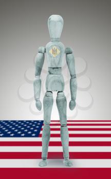 Old wood figure mannequin with US state flag bodypaint - Delaware