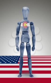 Old wood figure mannequin with US state flag bodypaint - Colorado