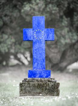 Old weathered gravestone in the cemetery - European Union