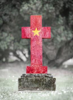Old weathered gravestone in the cemetery - Vietnam