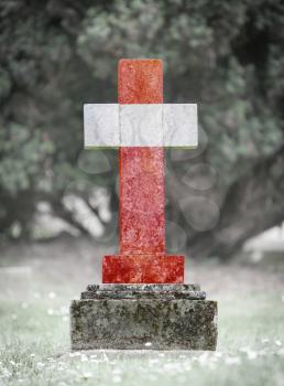 Old weathered gravestone in the cemetery - Austria