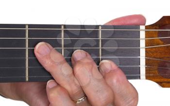 Old hand and guitar isolated on white background