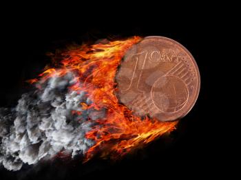 Burning coin with a trail of fire and smoke - 1 eurocent