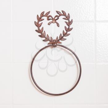 Ring shaped towel holder without towel, white wall