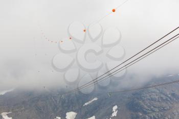 Funicular disappearing in clouds, Alps in Switzerland