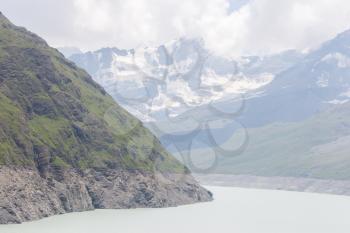 The green waters of Lake Dix - Dam Grand Dixence - Switzerland, worlds tallest gravity dam