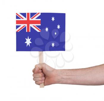 Hand holding small card, isolated on white - Flag of Australia