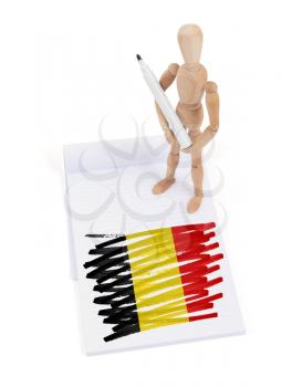 Wooden mannequin made a drawing of a flag - Belgium