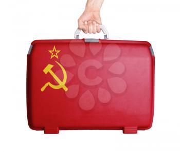 Used plastic suitcase with stains and scratches, printed with flag - USSR