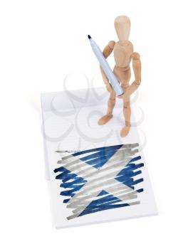 Wooden mannequin made a drawing of a flag - Scotland