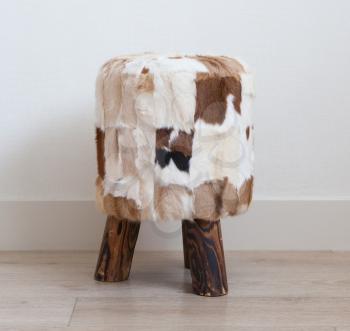 Small stool made of cowhide and wood