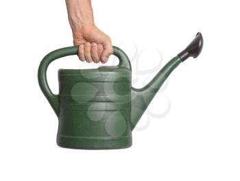 Hand holding green watering can, isolated on white