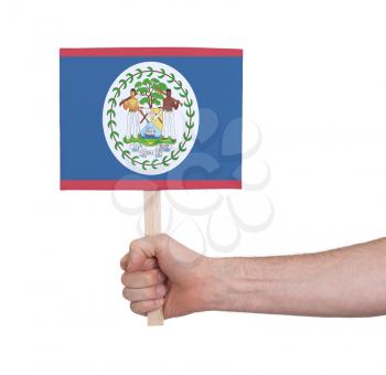 Hand holding small card, isolated on white - Flag of Belize