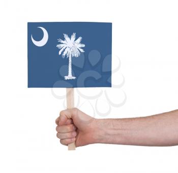 Hand holding small card, isolated on white - Flag of Oklahoma