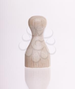 Wooden pawn isolated on a white background