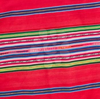 Closeup of a tablecloth made of linen with colorful stripes