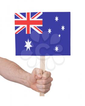 Hand holding small card, isolated on white - Flag of Australia
