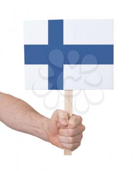 Hand holding small card, isolated on white - Flag of Finland
