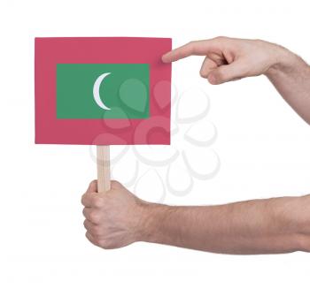 Hand holding small card, isolated on white - Flag of Maldives