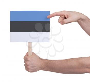 Hand holding small card, isolated on white - Flag of Estonia