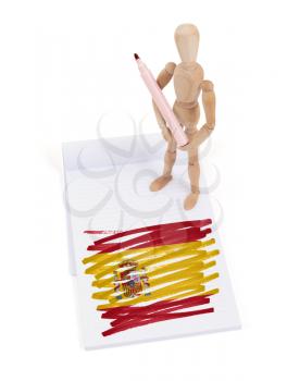 Wooden mannequin made a drawing of a flag - Spain