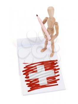 Wooden mannequin made a drawing of a flag - Switzerland