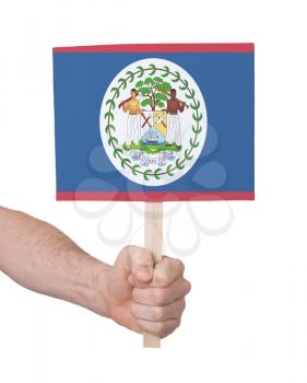 Hand holding small card, isolated on white - Flag of Belize