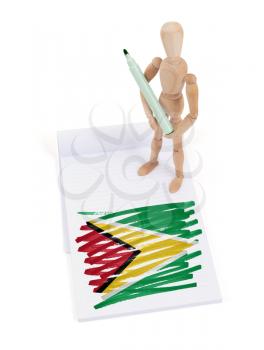 Wooden mannequin made a drawing of a flag - Guyana