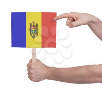 Hand holding small card, isolated on white - Flag of Moldova