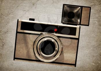 Old camera, isolated on a vintage background