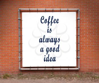 Large banner with inspirational quote on a brick wall - Coffee is alwways a good idea