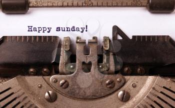 Vintage typewriter close-up - Happy Sunday, concept of motivation