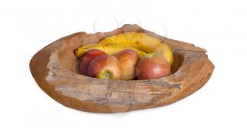 Ripe fruit assortment in a wooden bowl isolated on white