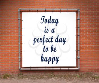 Large banner with inspirational quote on a brick wall - Today is a perfect day to be happy