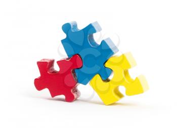 Closeup of big jigsaw puzzle pieces isolated on white