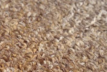Carpet texture close-up, beige furry carpet texture background, selective focus