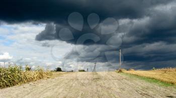 The dark clouds up to a thunder-storm and rain