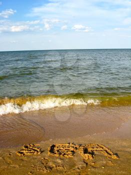 The image of inscription on the sea sand