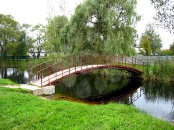 nice bridge across river in the park