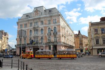 lively street with promenade tramway in the central part of Lvov