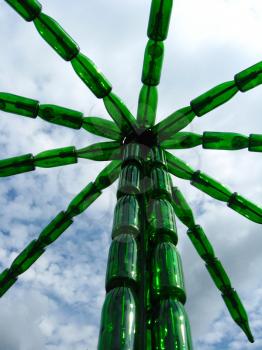 the image of palm tree made of bottles from a champagne