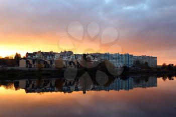 beautiful landscape with sunset, river and modern house reflecting in it