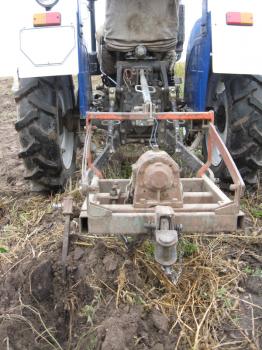 image of process of harvesting of a potato