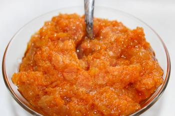 red squash paste in a plate with the fork