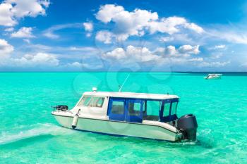 MALDIVES - JUNE 24, 2018: Boat at Tropical beach in the Maldives at summer day