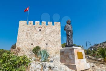 Statue of Barbaros Hayreddin Pasha and Pirate castle on Pigeon Island in Kusadasi, Turkey in a beautiful summer day