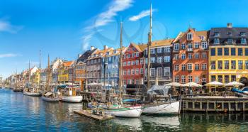 Nyhavn district is one of the most famous and beautiful landmark in Copenhagen, Denmark in a sunny day