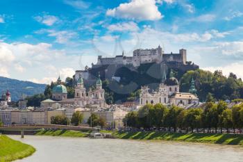 Panoramic view of Salzburg, fortress Hohensalzburg and Salzach river in Austria in a beautiful summer day